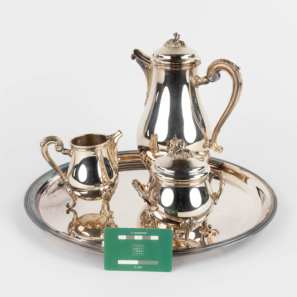Christofle, a Chocolatière, sugar pot and milk jug on a serving tray. Silver-plated metal. (H:26 x D:39 cm)