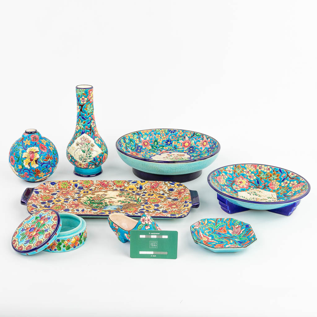 A collection of 8 pieces of ceramics made by Longwy. 