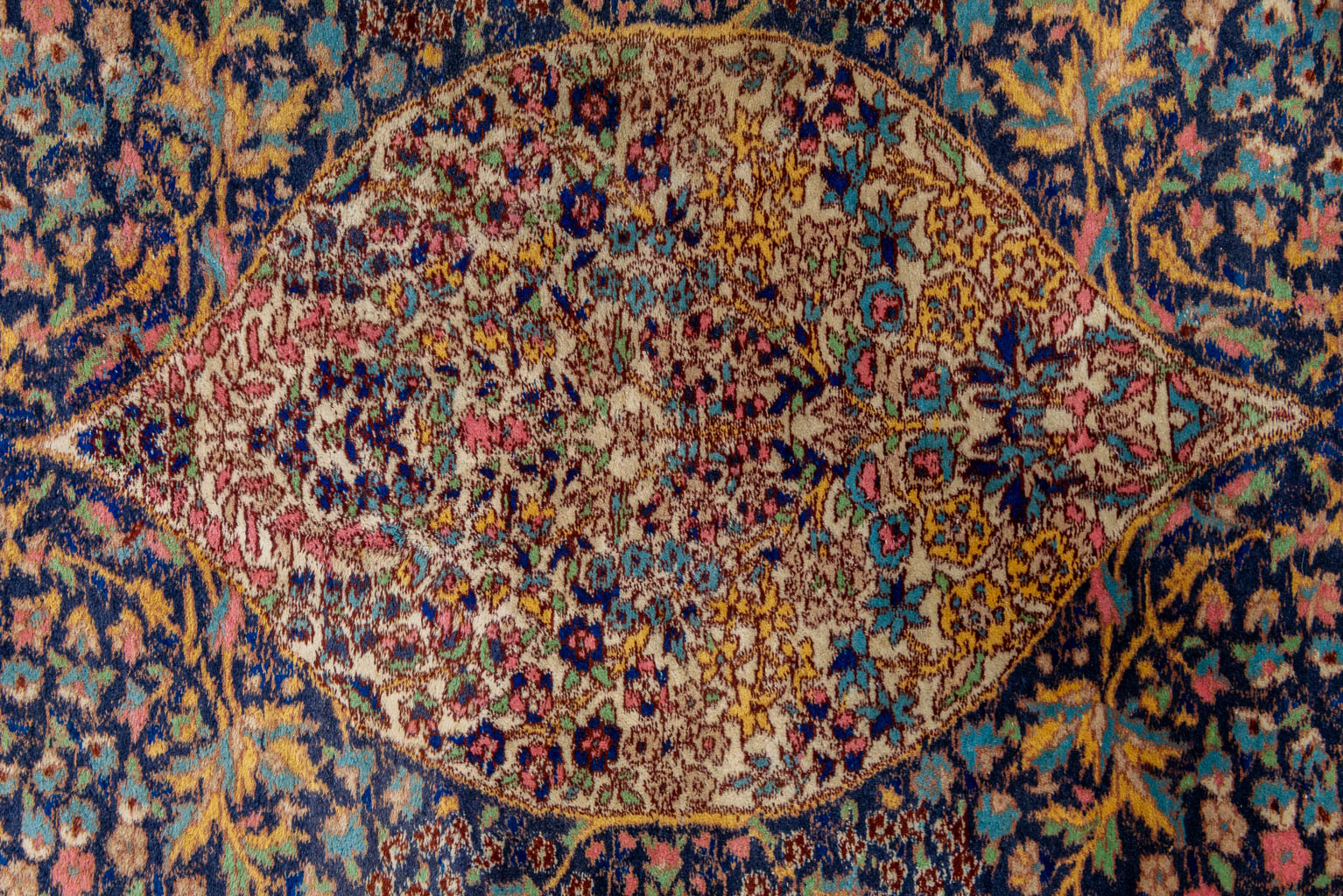 An oriental hand-made carpet. (228 x 148 cm)