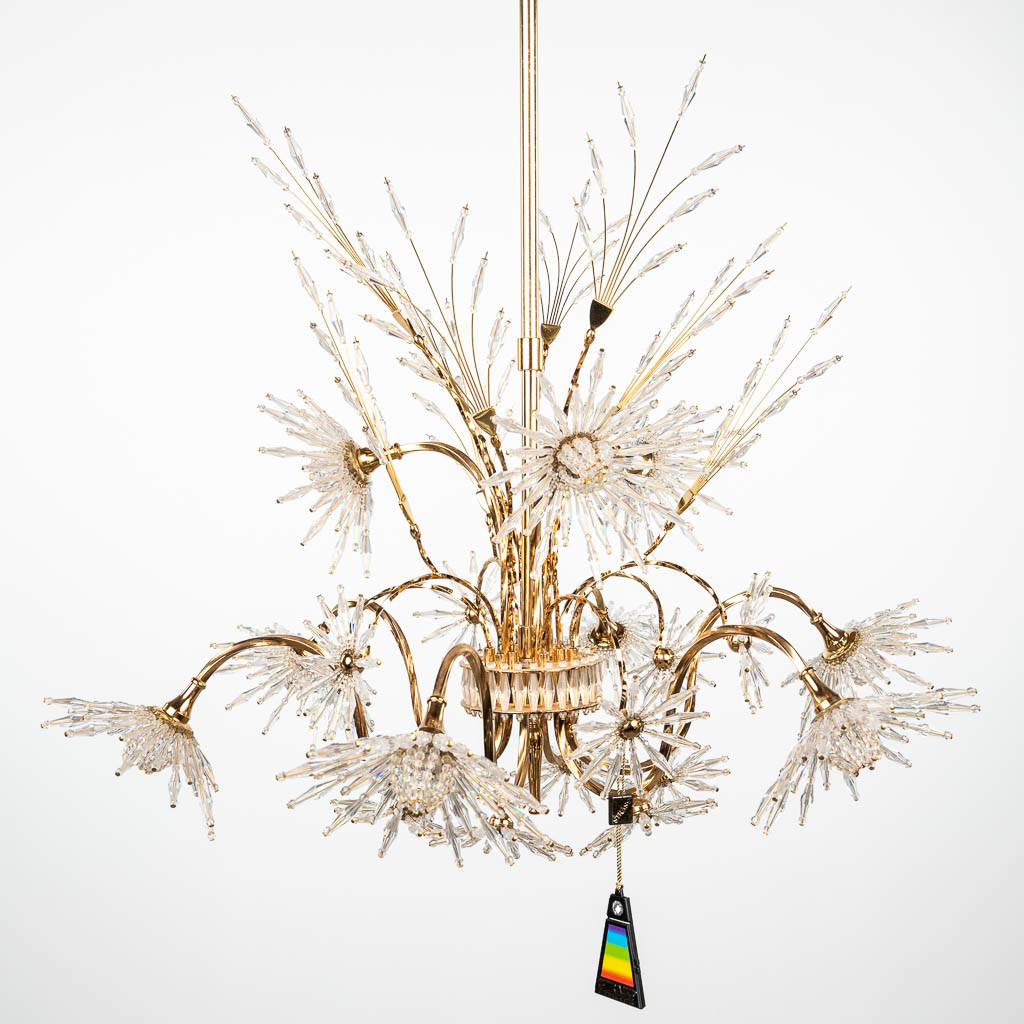 A vintage chandelier made of cut glass and marked Strass Swarovski. (H:80cm)