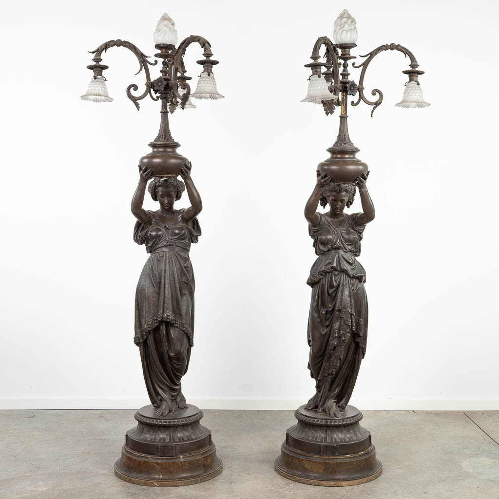  A pair of neoclassical standing lamps or Torchères with Greek lady figurines. (60 x 50 x 190cm)