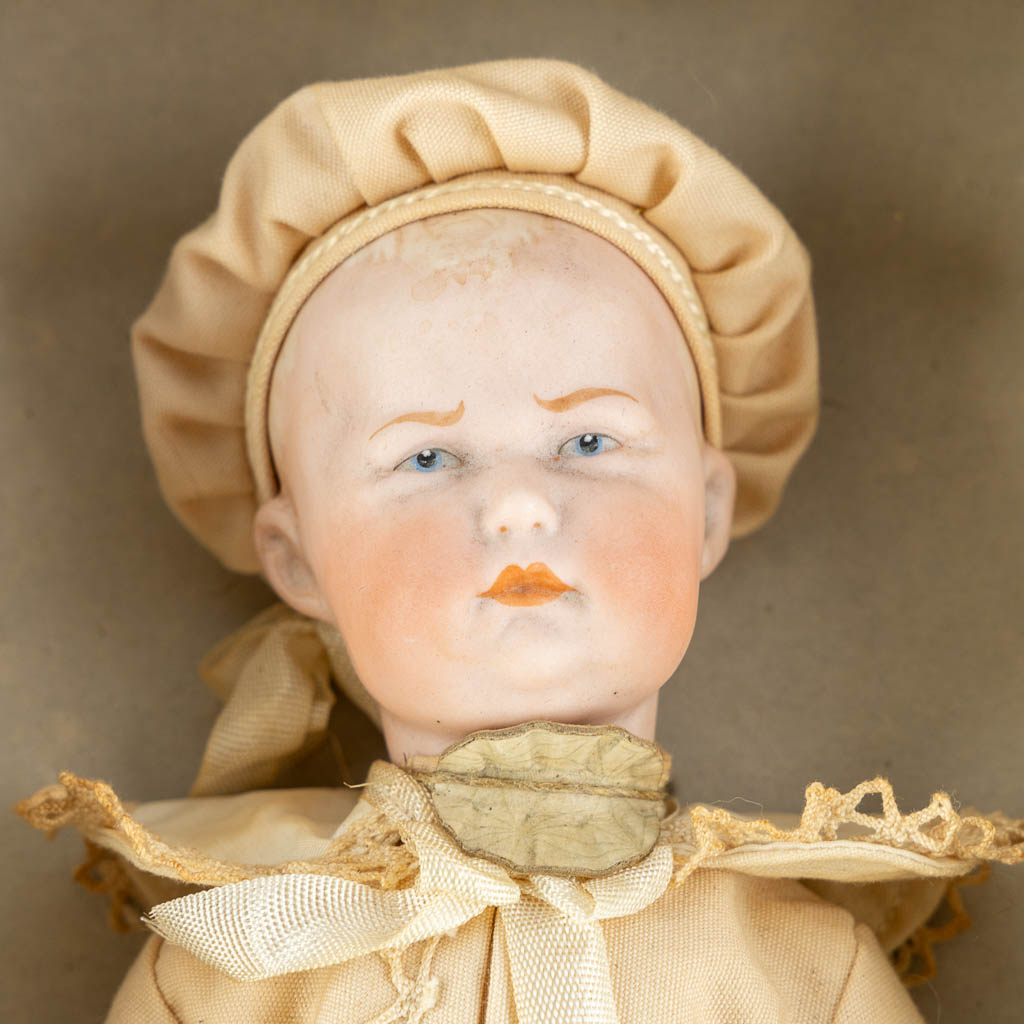 Heubach, Germany, a bisque doll in the original box. (L:7,5 x W:16,5 x H:33,5 cm)