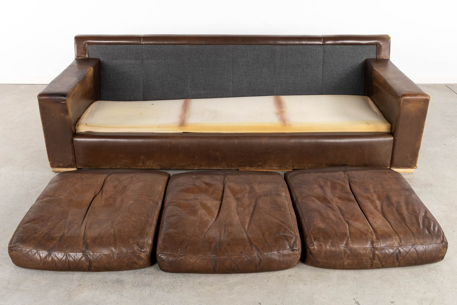 A vintage, three-person leather sofa. Circa 1970. (L:90 x W:225 x H:78 cm)