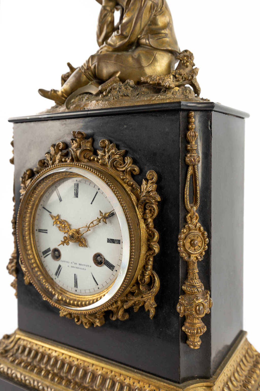 A mantle clock, black marble with a bronze figurine. 19th C. (D:12 x W:22 x H:41 cm)