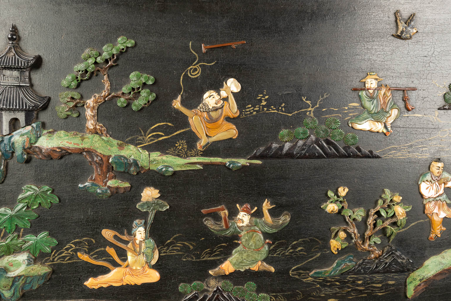 A Chinese sculptured table screen with images of the 8 immortals, cranes, deer and pine trees. (H:80cm)