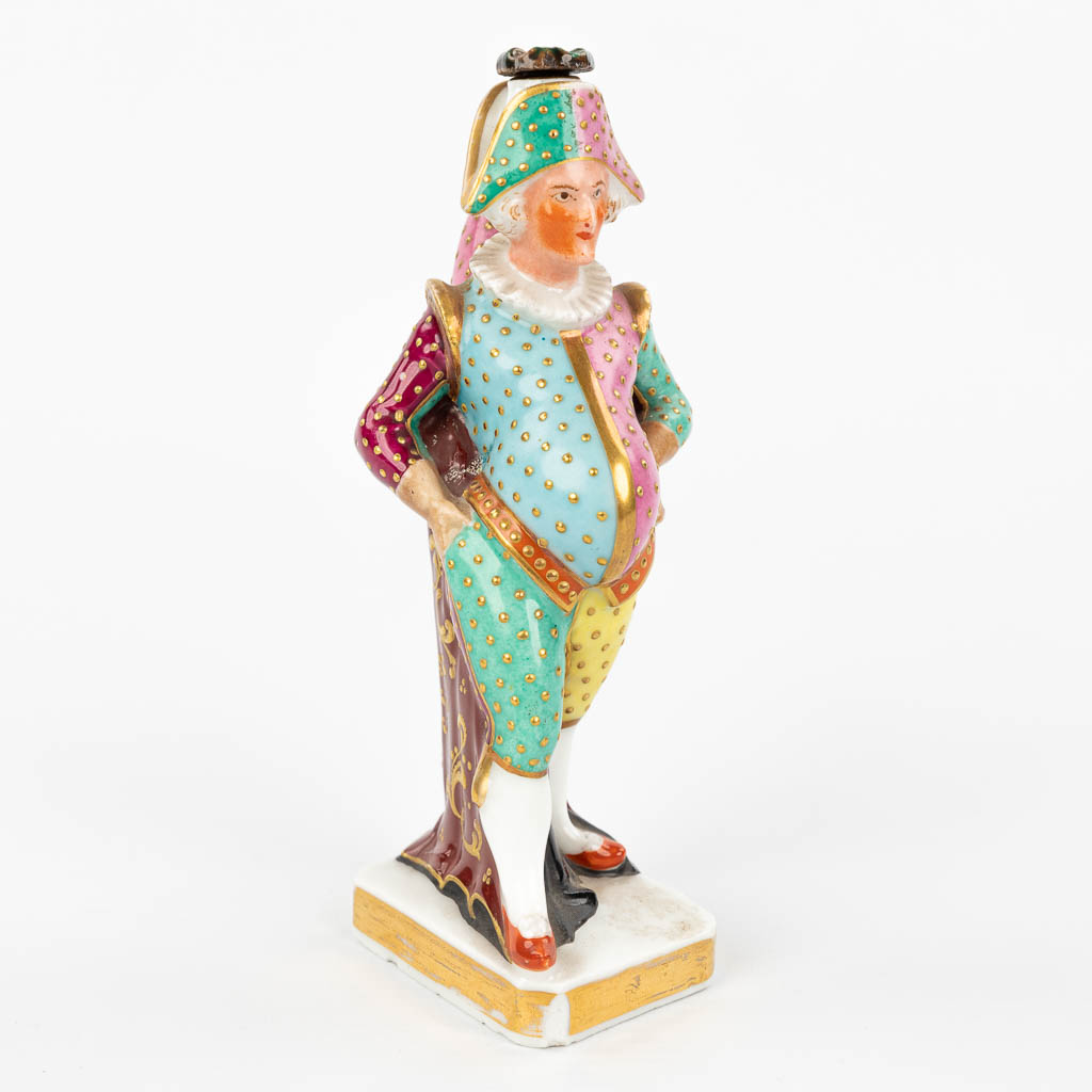 JACOB-PETIT (1796-1868) a perfume bottle in the shape of a harlequin, made of porcelain. (H:15,5cm)