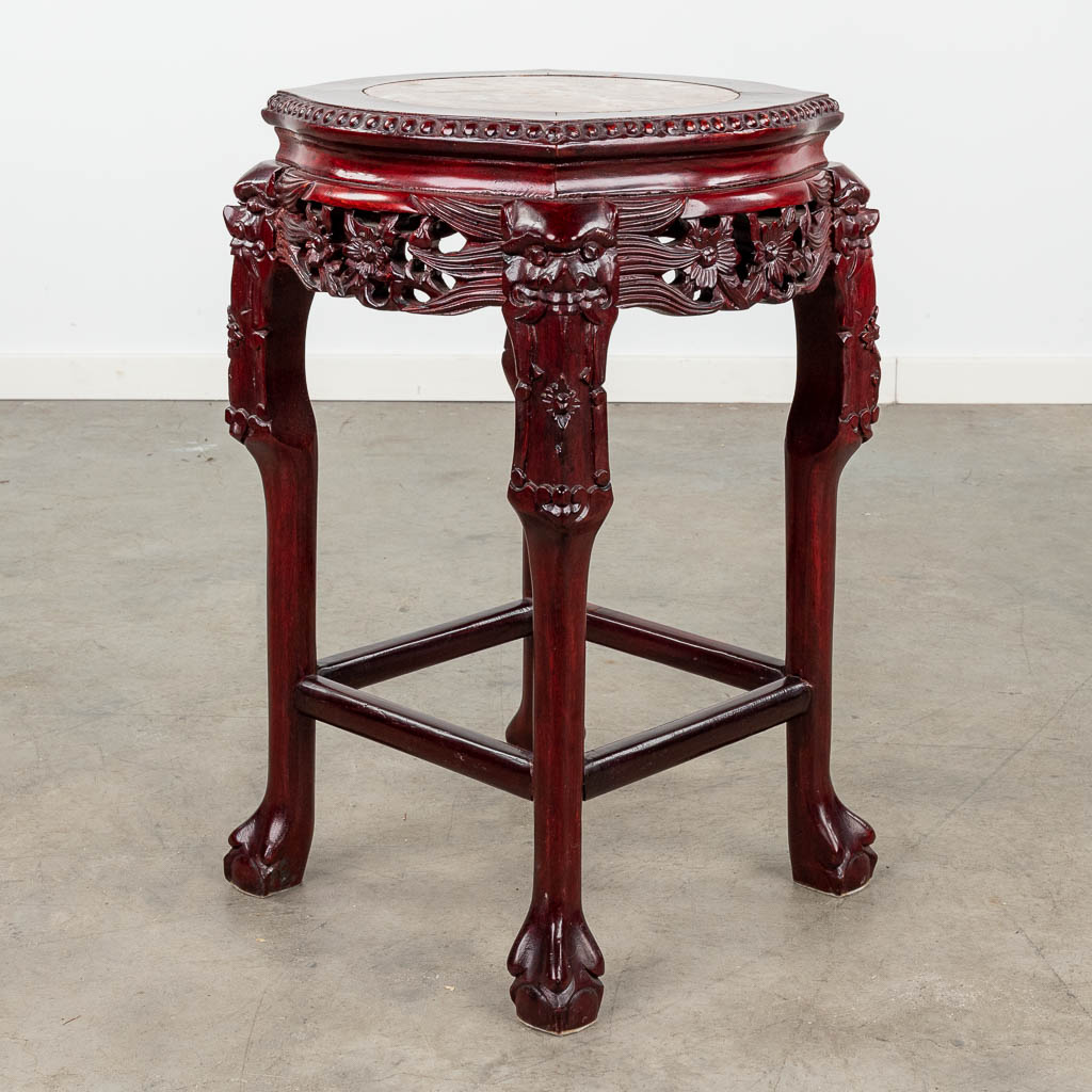 An Oriental stand, hardwood and decorated with a marble top. (L: 40 x W: 40 x H: 62 cm)