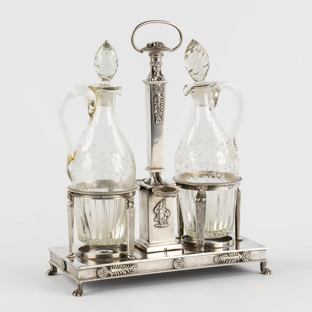 Lot 009 An oil and vinegar set, silver, Paris, France, 950/1000. Empire period, 1809-1819. (L:11 x W:23 x H:29 cm)