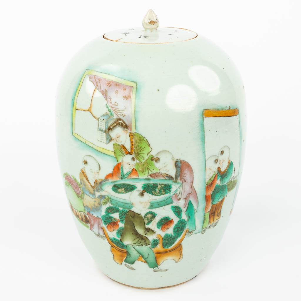 Lot 020 A Chinese jar with lid and decorated with children looking in the fishbowl. (H:31cm)