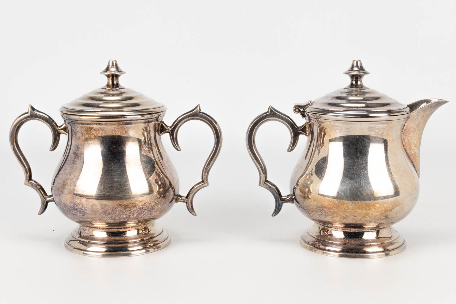 A coffee and tea service made of silver-plated metal. 