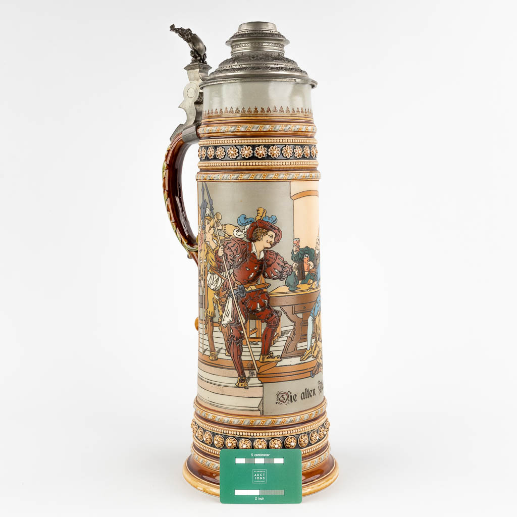 Mettlach, a large beer pitcher with polychrome decor, grès. Germany, 20th C. (D:18 x W:21 x H:51 cm)