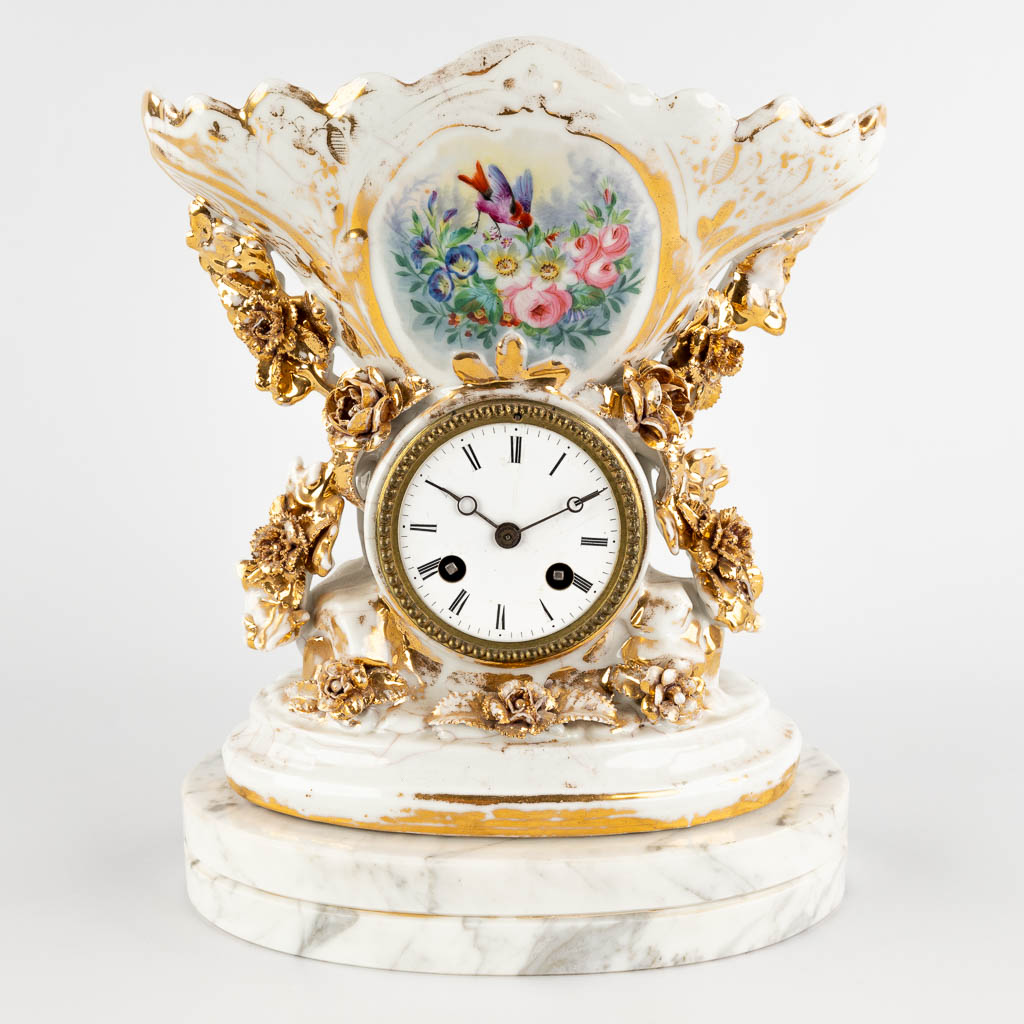 Vieux Bruxelles, a mantle clock with a hand-painted floral decor. 19th C. (D:13 x W:26 x H:31 cm)