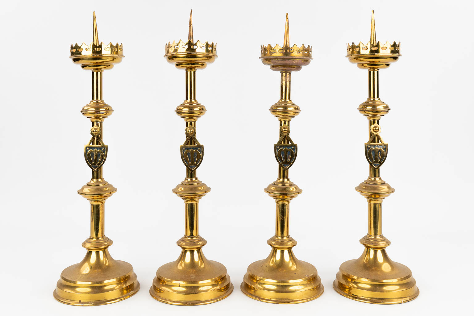 A set of 4 Church candlesticks made of bronze in gothic revival style. (H: 50 cm)