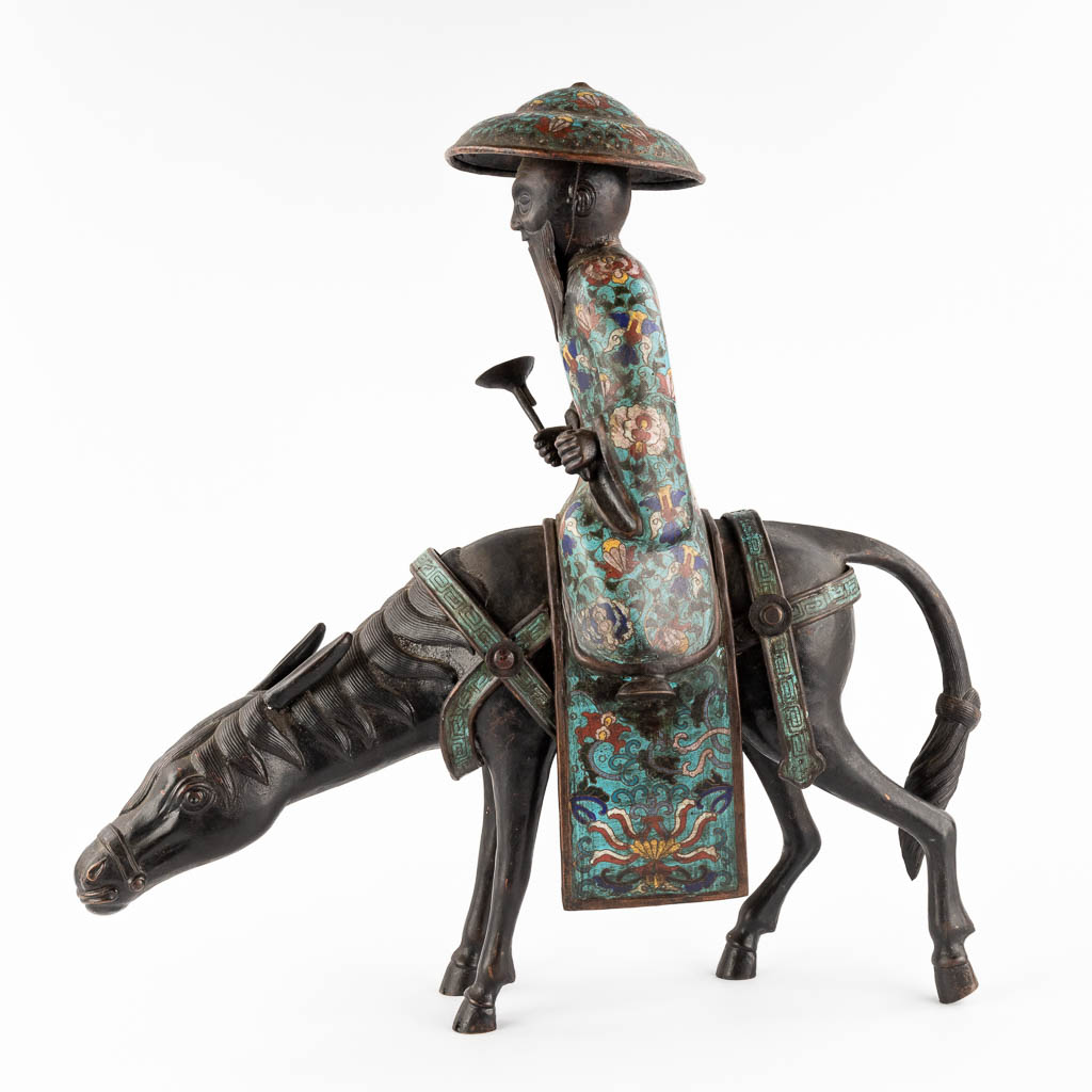A Japanese figure of Lao Zi seated on a mule, Champslevé bronze. Possibly Meji period. (D:18 x W:55 x H:57 cm)