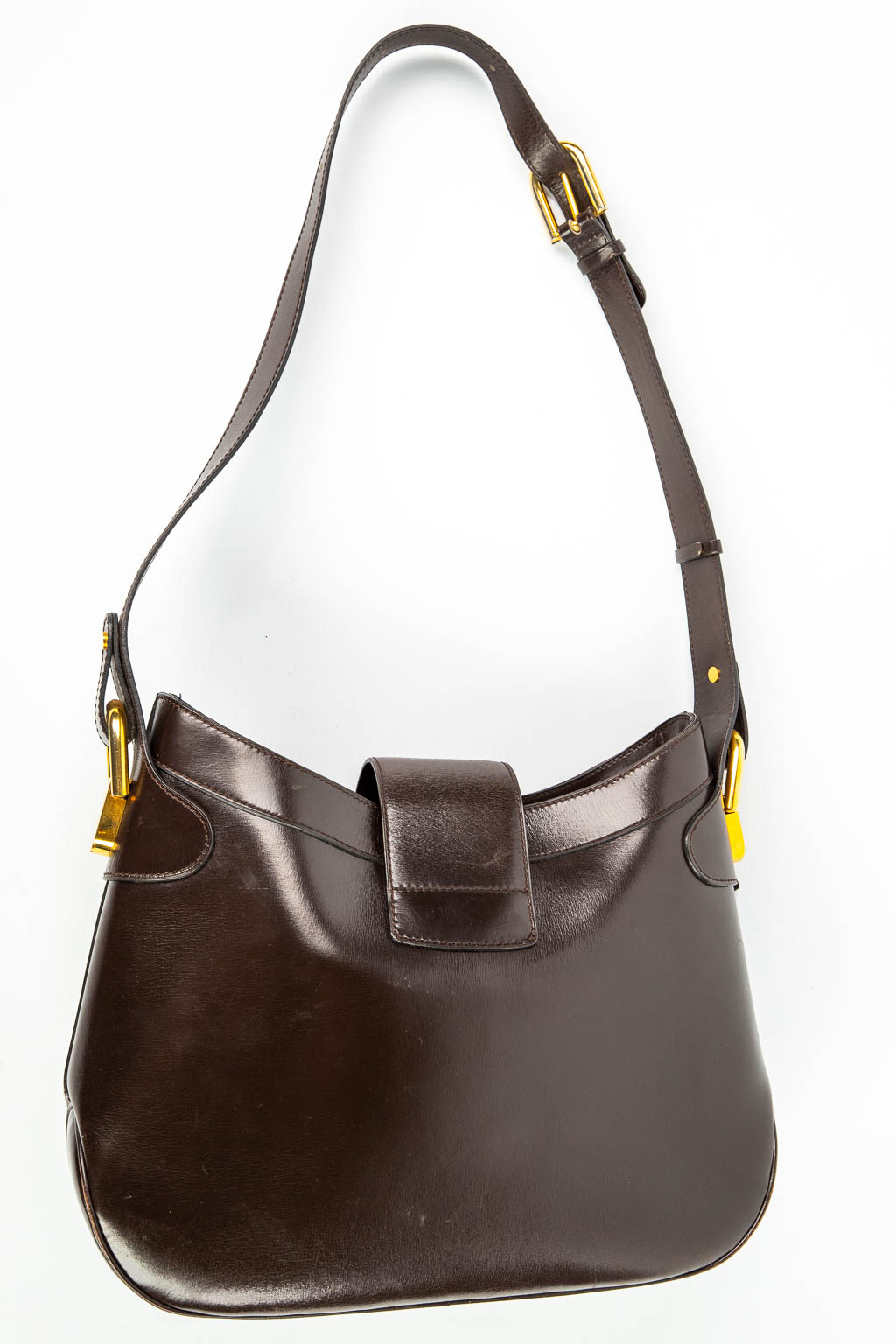 A purse made of brown leather and marked Delvaux. Mounted with gold-plated elements. (H:23cm)
