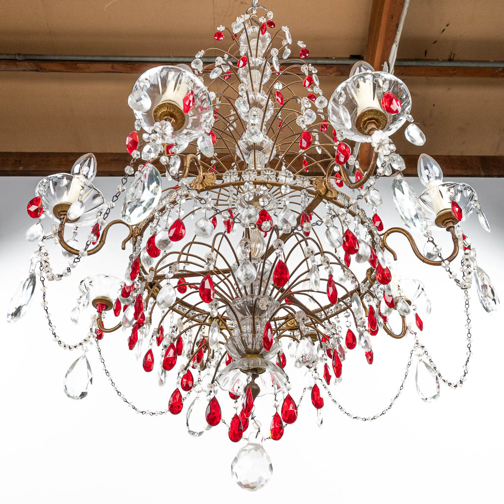A decorative chandelier made of brass and decorated with white and red glass. (H:95cm)