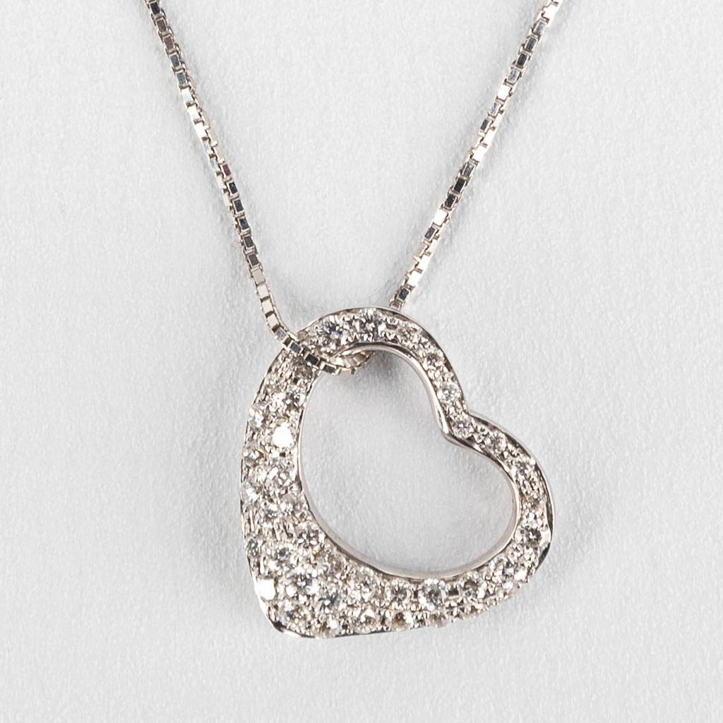 A necklace with a pendant in the shape of a heart. Brilliants, approx. 0.38ct.