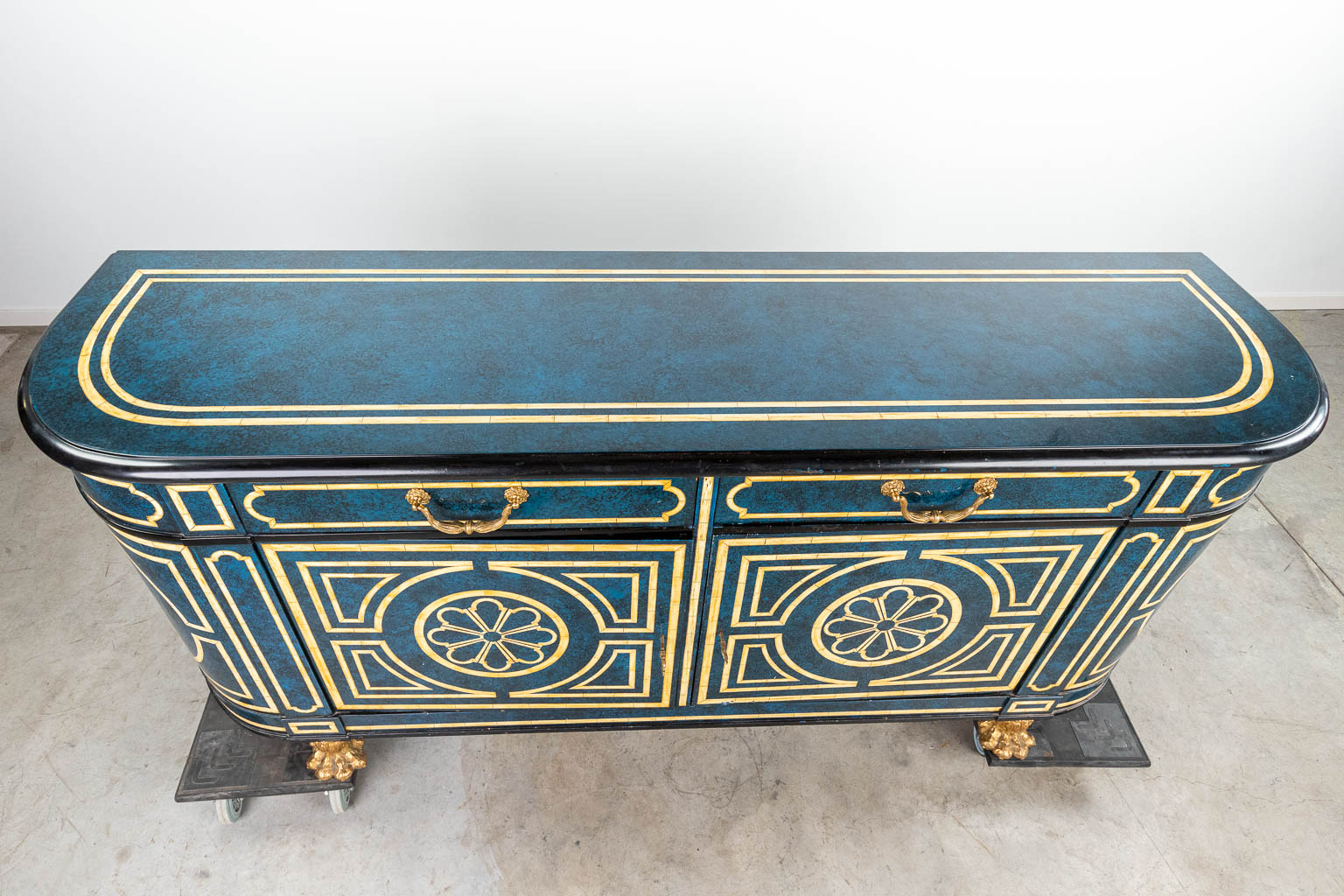 A sideboard with faux Lapis Lazuli and inlaid bone in Hollywood Regency style, standing on bronze claw feet. (H:90cm)