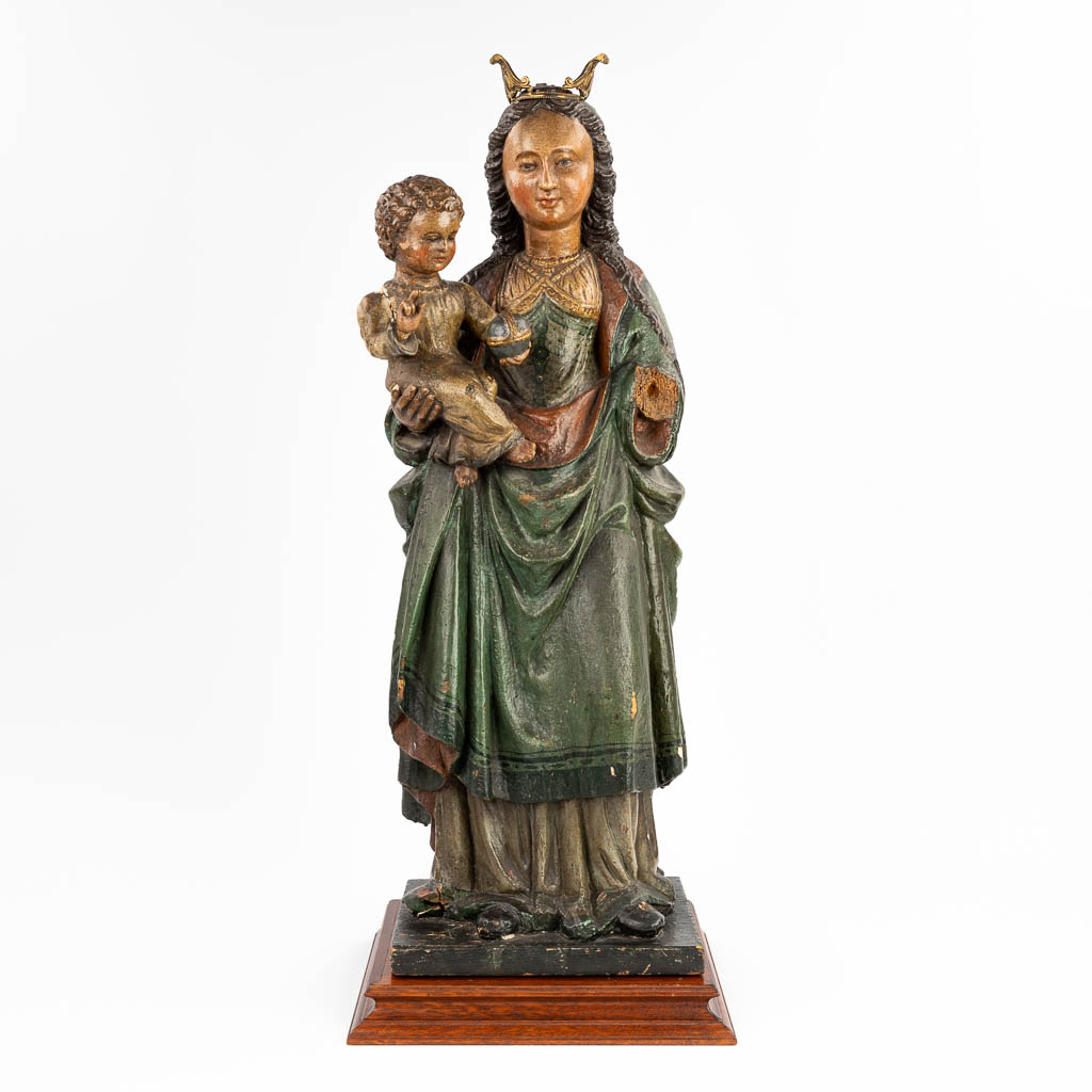 An antique polychrome statue of Madonna with a child, made of sculptured wood (18,5 x 25,5 x 73cm)