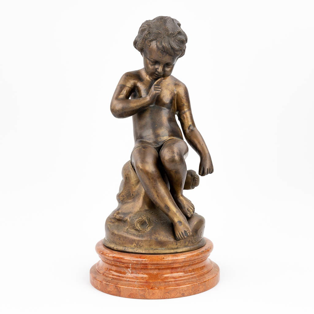  A seated young child, statue made of bronze. 20th century. (H:50 cm)