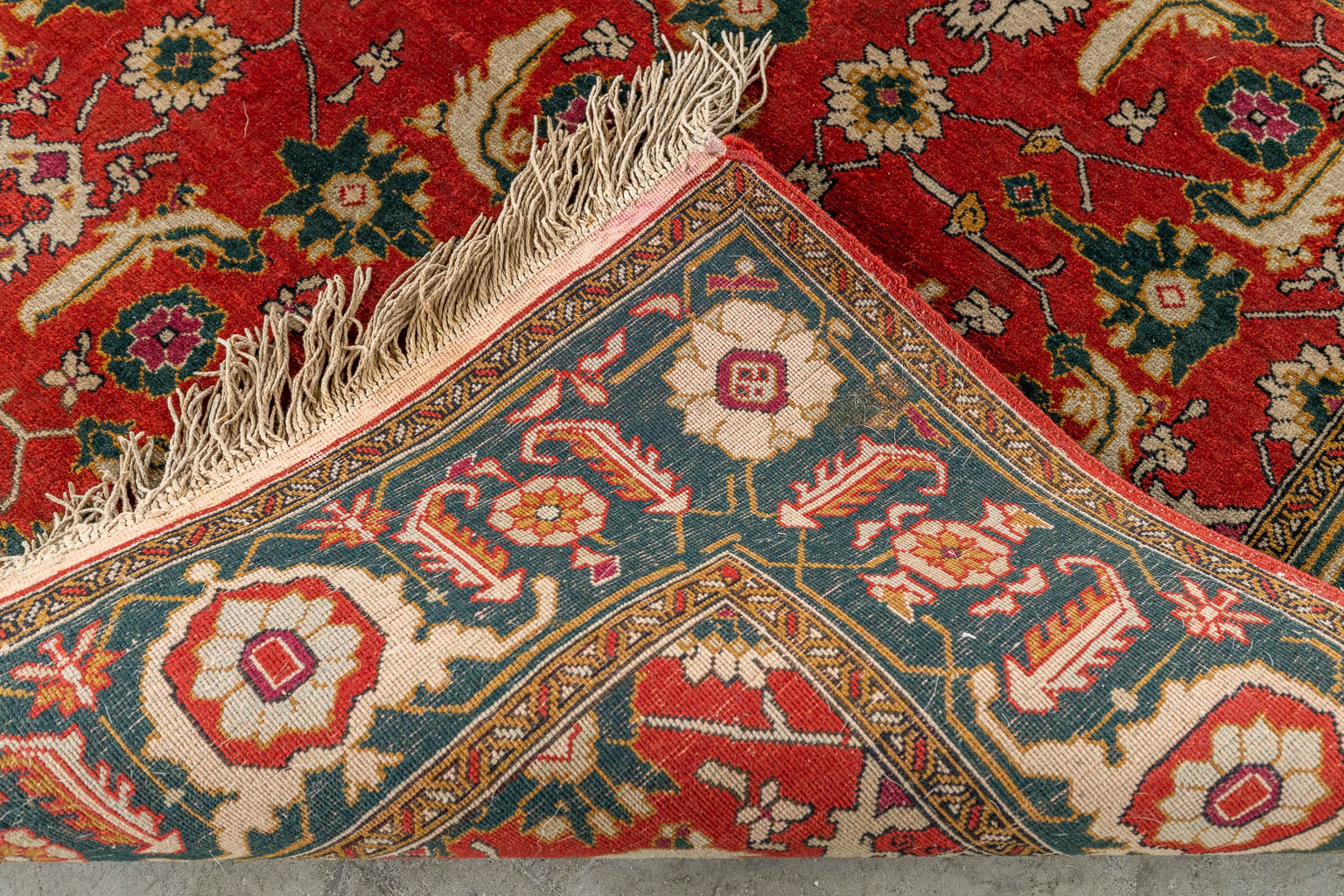 An Oriental hand-made carpet, Persian. (D:173 x W:128 cm)