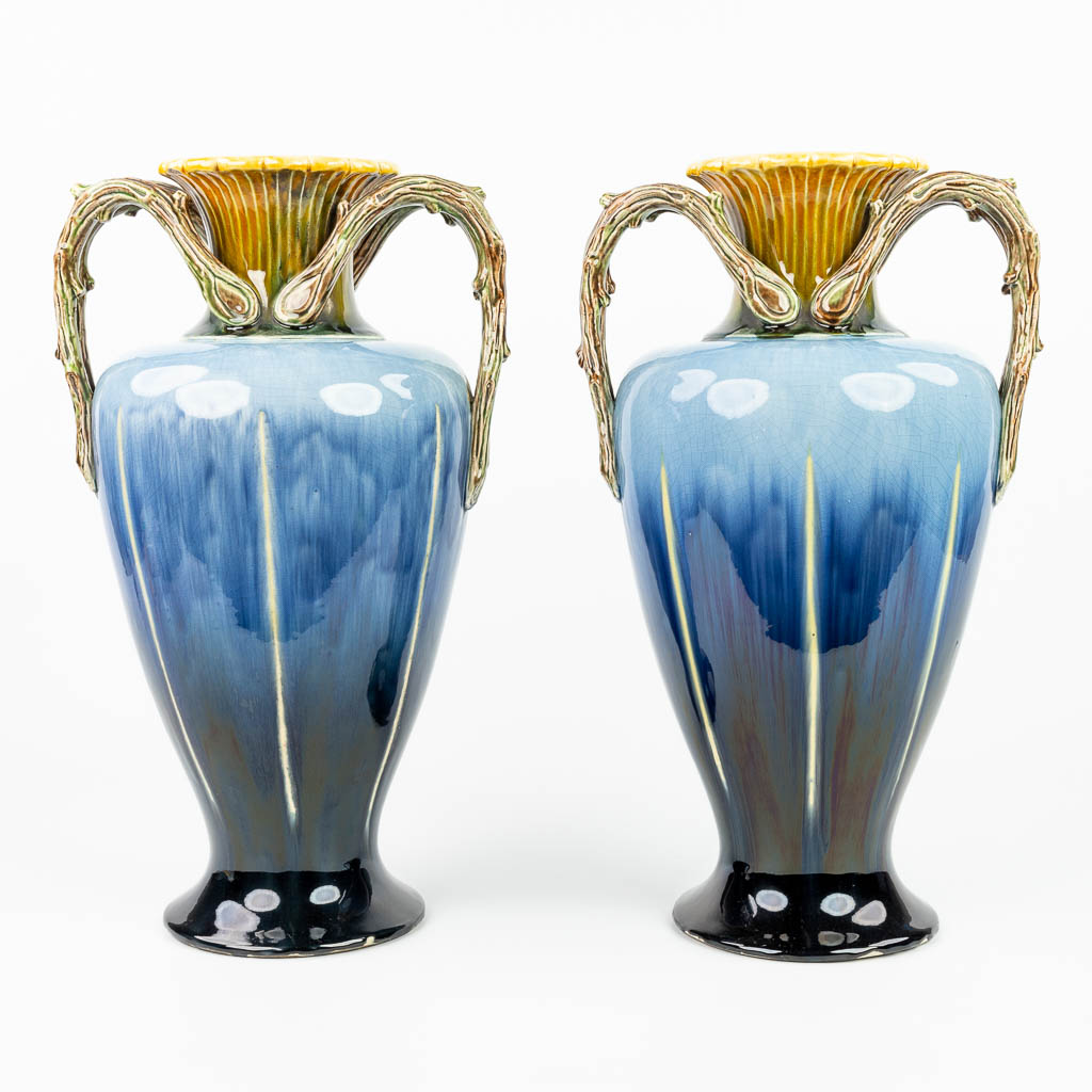 A pair of vases made of glazed faience in art nouveau style and made in Hasselt, Belgium. (H:50,5cm)