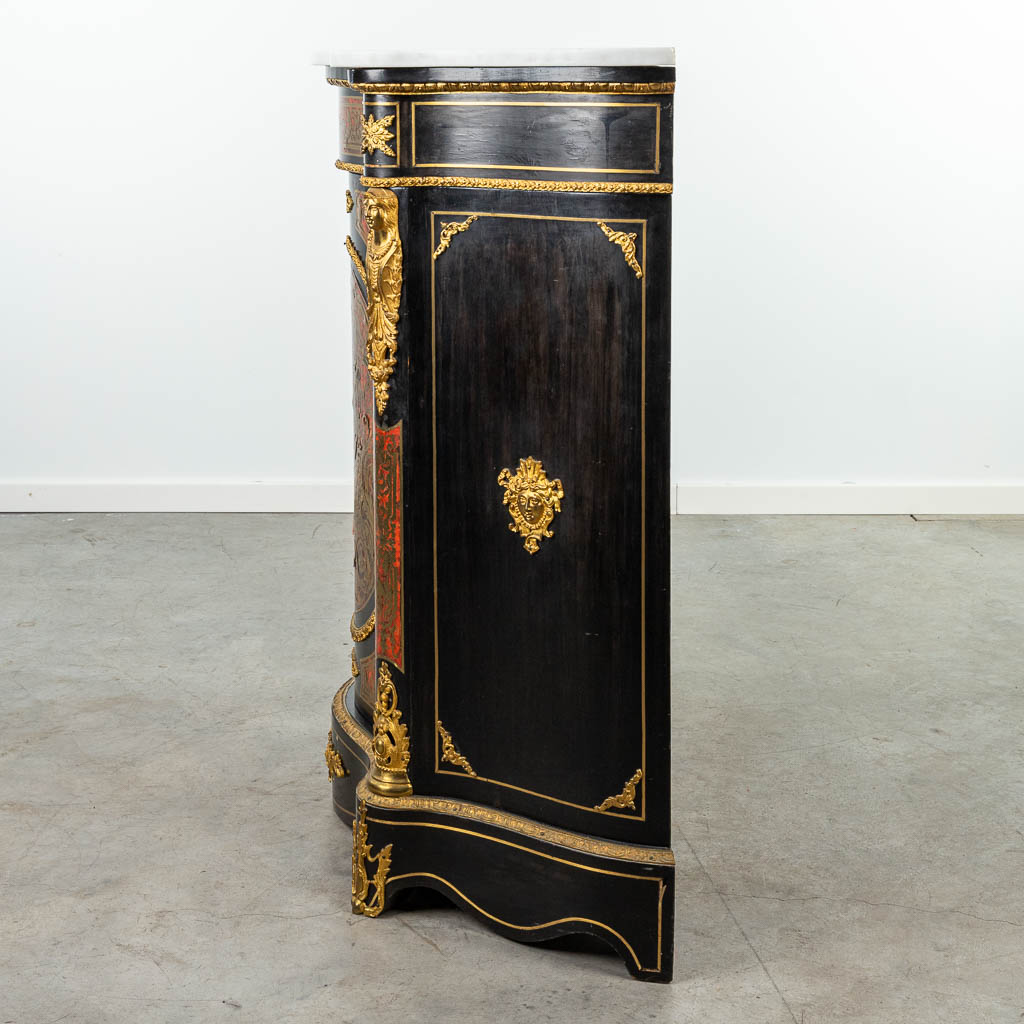 A cabinet with marble top made in Napoleon 3 style, mounted with bronze and finished with boulle tortoiseshell. (H:106,5cm)
