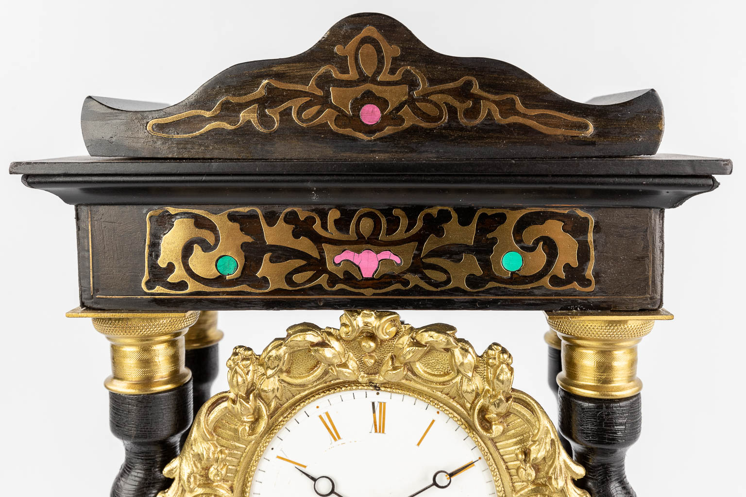 A column clock finished with copper inlay in Napoleon 3 style. 19th C. (L: 14 x W: 25 x H: 48 cm)