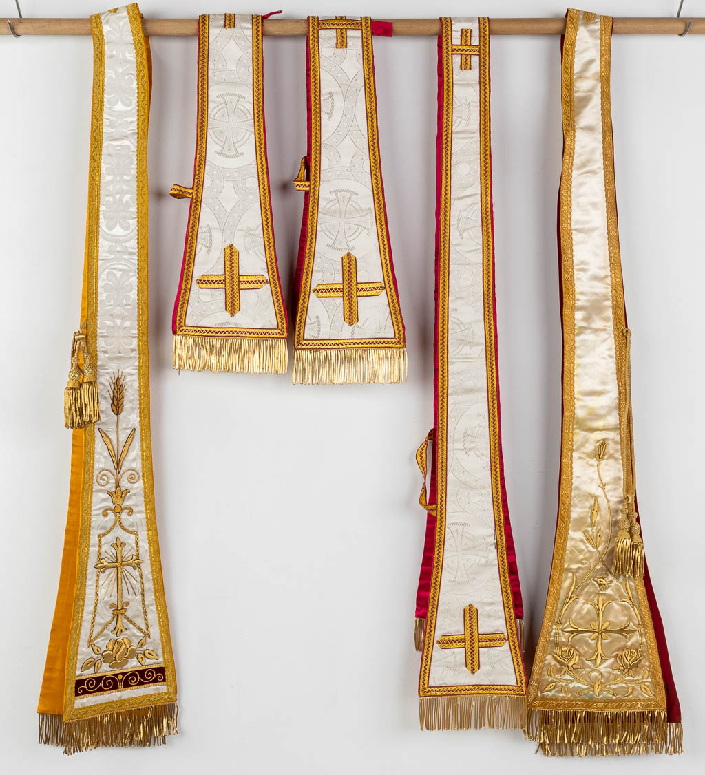 A matching set of Liturgical robes, 4 dalmatics, maniples and stola.