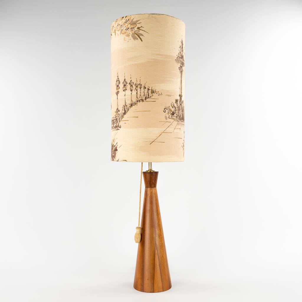 A mid-century Scandinavian table lamp, turned wood with the original lampshade. (H:101 x D:28,5 cm)