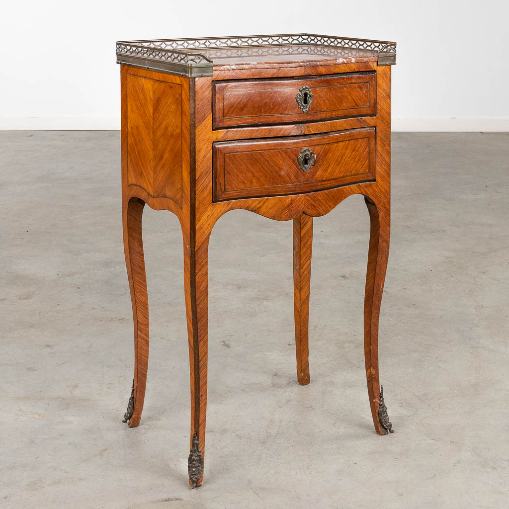 A small two-dawer cabinet with brass gallery and a marble top. Transition, 18th C. (D:30 x W:42 x H:72,5 cm)