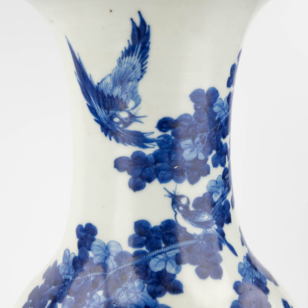 A Chinese vase with blue-white decor of a Phoenix and Cranes. 19th/20th C. (H: 61 x D: 23 cm)