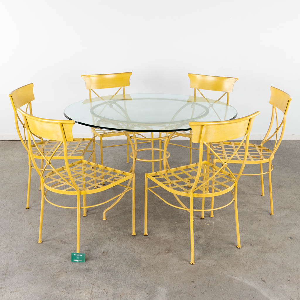 A round table with 6 matching chairs, painted metal. 20th C. (H:77 x D:130 cm)