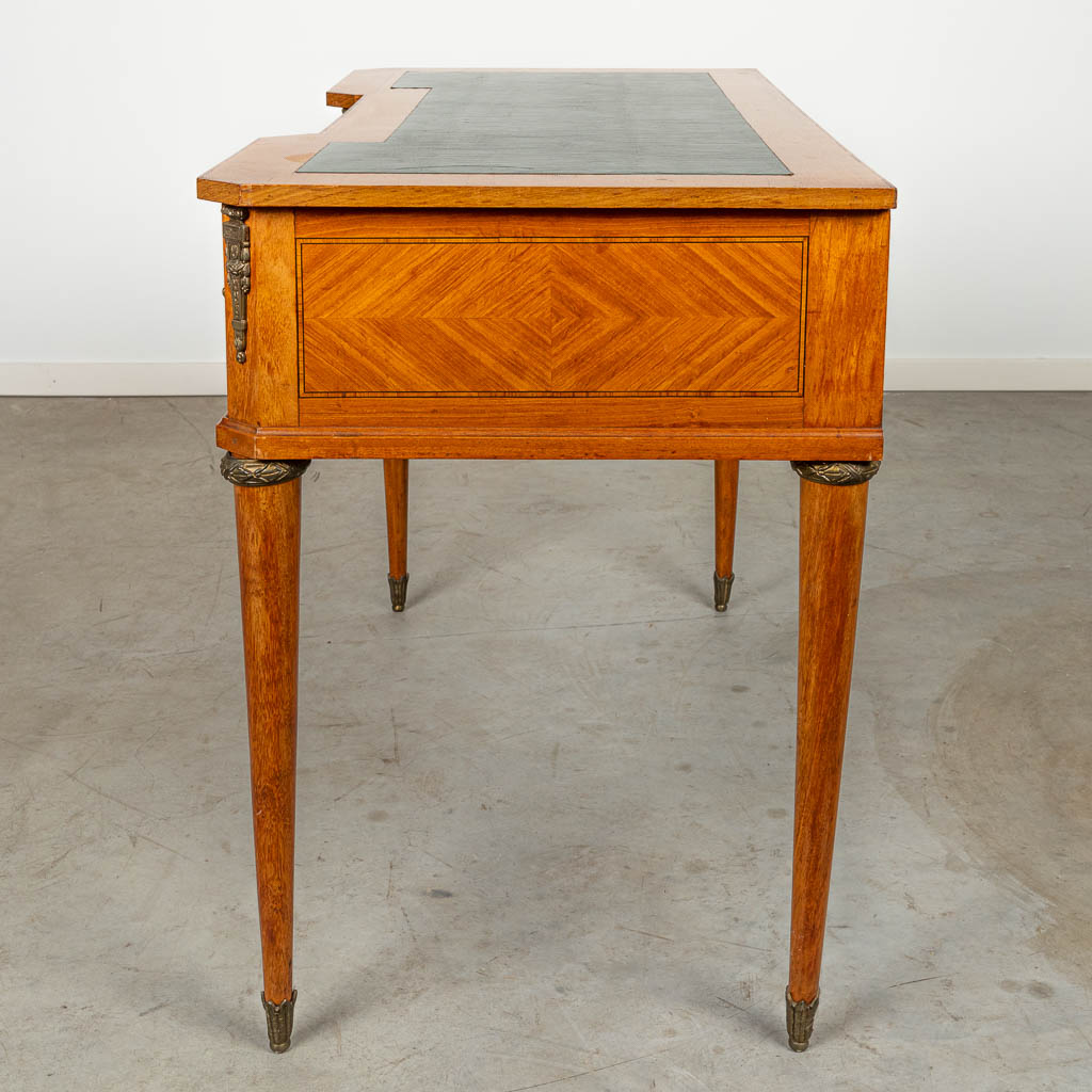 A desk made in Louis XVI style, around 1900. 