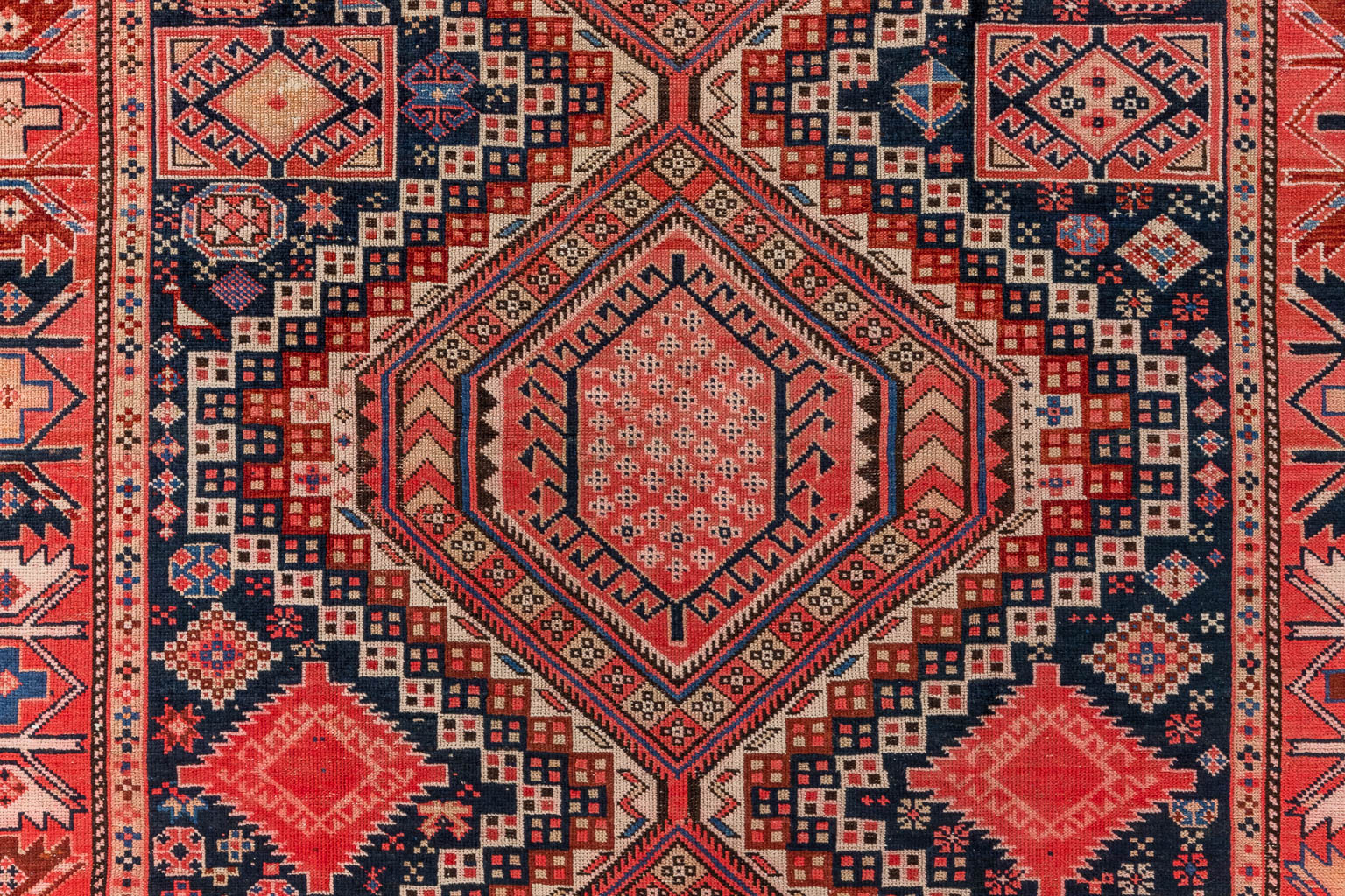 An Oriental hand-made carpet, Shirvan, Kaukasus. (D:305 x W:149 cm)