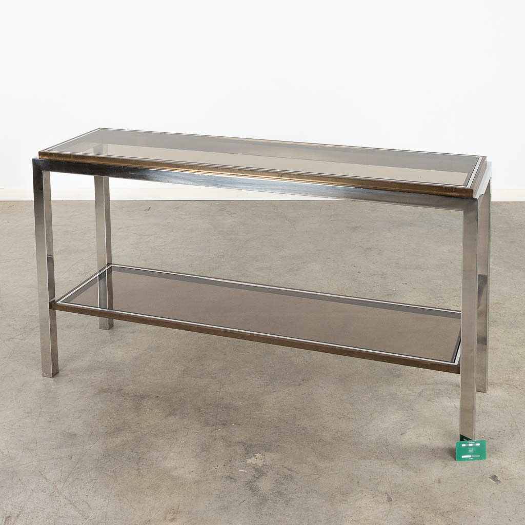 Belgo Chrome, een consoletafel met fumé glas. (D:40 x W:140 x H:77 cm)