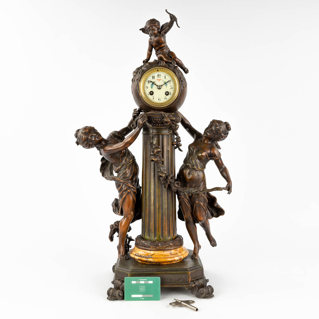 L & F Moreau, a mantle garniture clock, spelter, Circa 1900. (L: 26 x W: 40 x H: 70 cm)