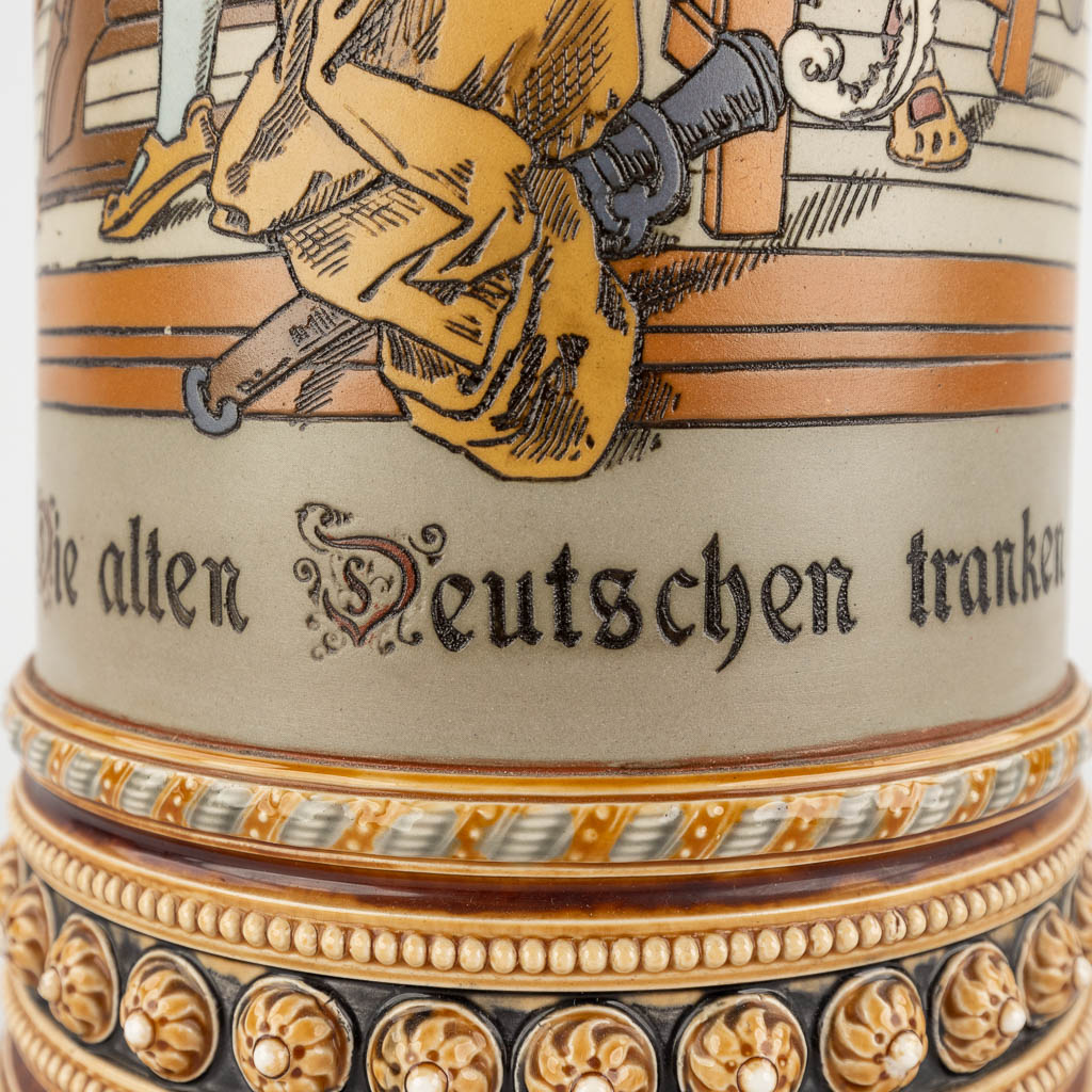 Mettlach, een grote bierkruik met polychroom decor, grès. Duitsland, 20ste eeuw. (D:18 x W:21 x H:51 cm)
