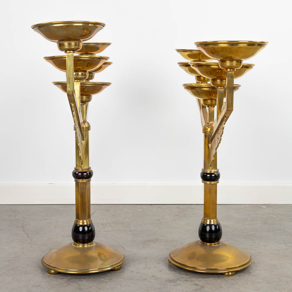A collection of 2 pairs of candlesticks made of bronze in art deco style. (H:53cm)