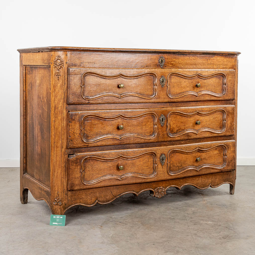 An antique commode with 3 drawers and a secretaire top, made of oak. (H:96cm)