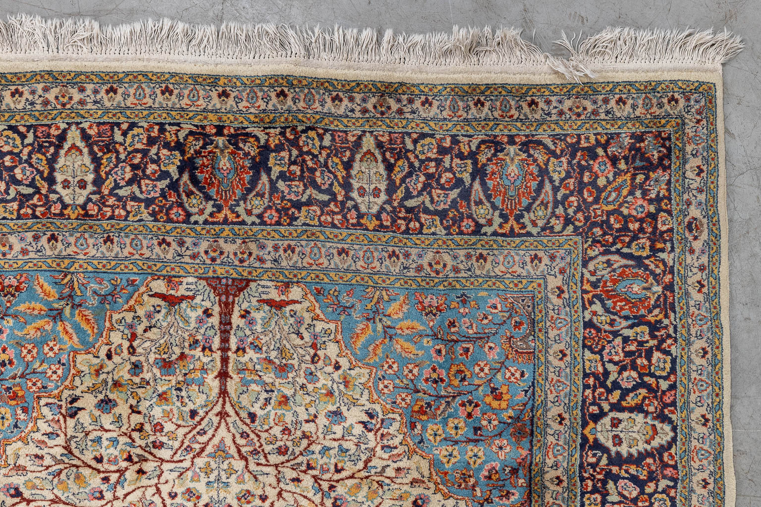 An Oriental hand-made carpet, flower decor, Tabriz. (L: 245 x W: 156 cm)
