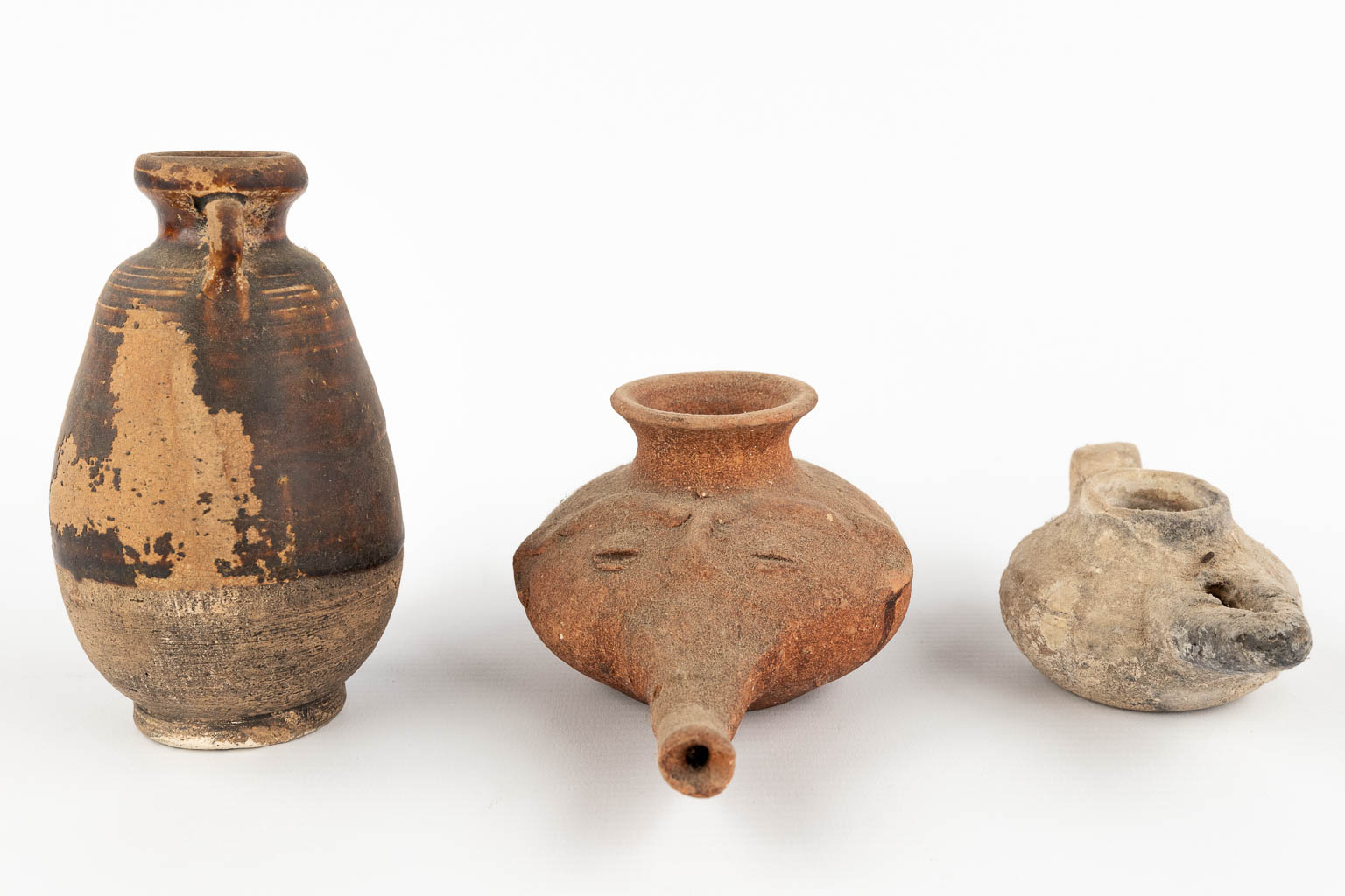 Vassels and oil lamps, 6 pieces, Possibly of Roman origin. (H:13 cm)