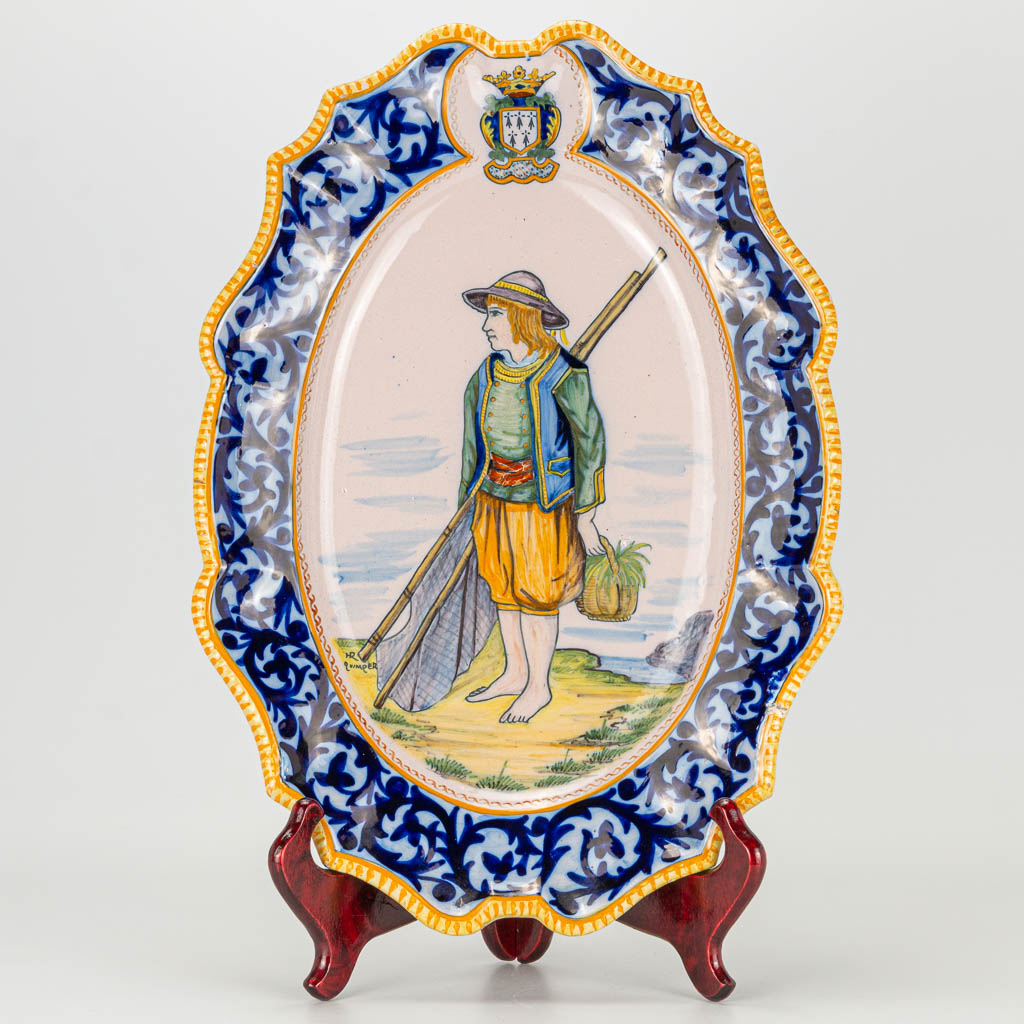 A ceramic plate with fisherman, marked Henriot Quimper. 