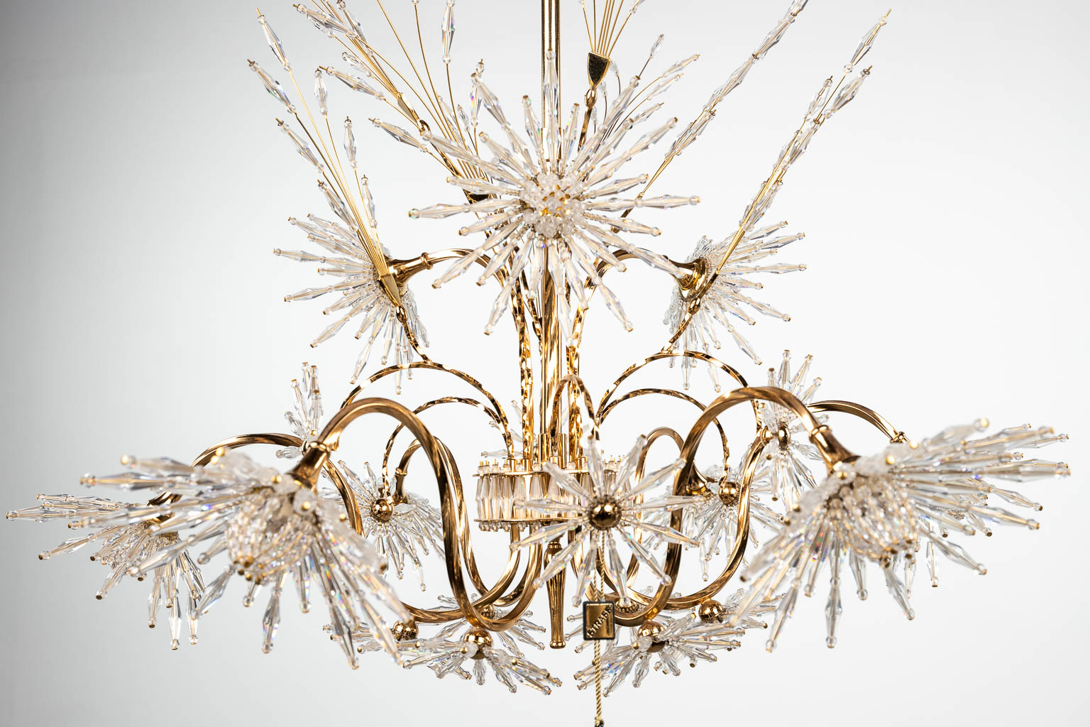 A vintage chandelier made of cut glass and marked Strass Swarovski. (H:80cm)