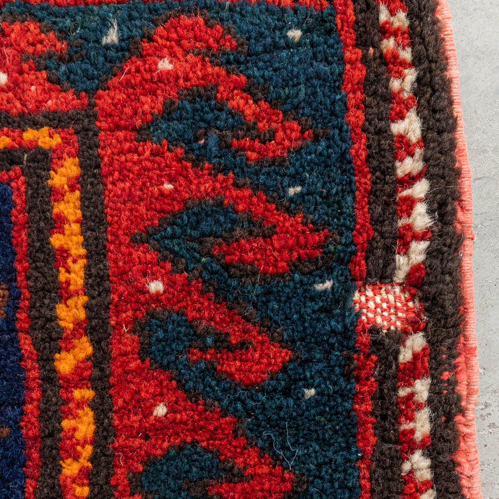 An Oriental hand-made carpet, Kazak. (D:230 x W:150 cm)