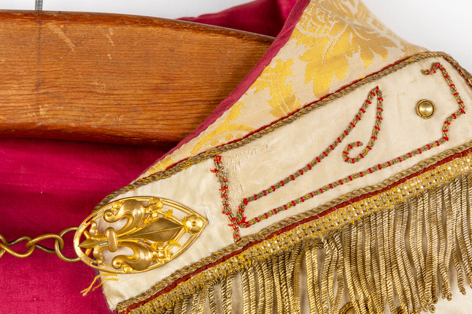 A cope, gold-thread embroideries with an image of Jesus Christ with a sacred heart.  
