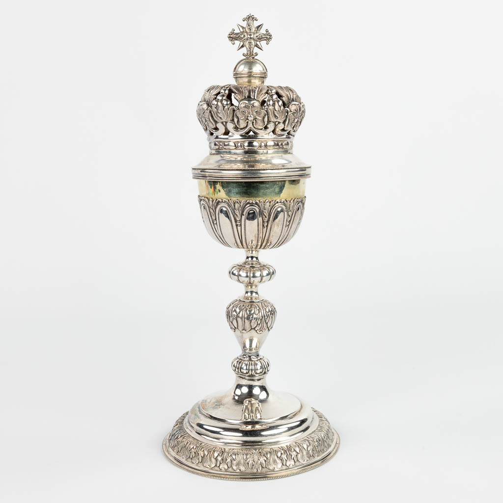 A ciboria made of silver with an open-worked crown. Marked with double Janus, 833/1000. 508g. (H:32cm)