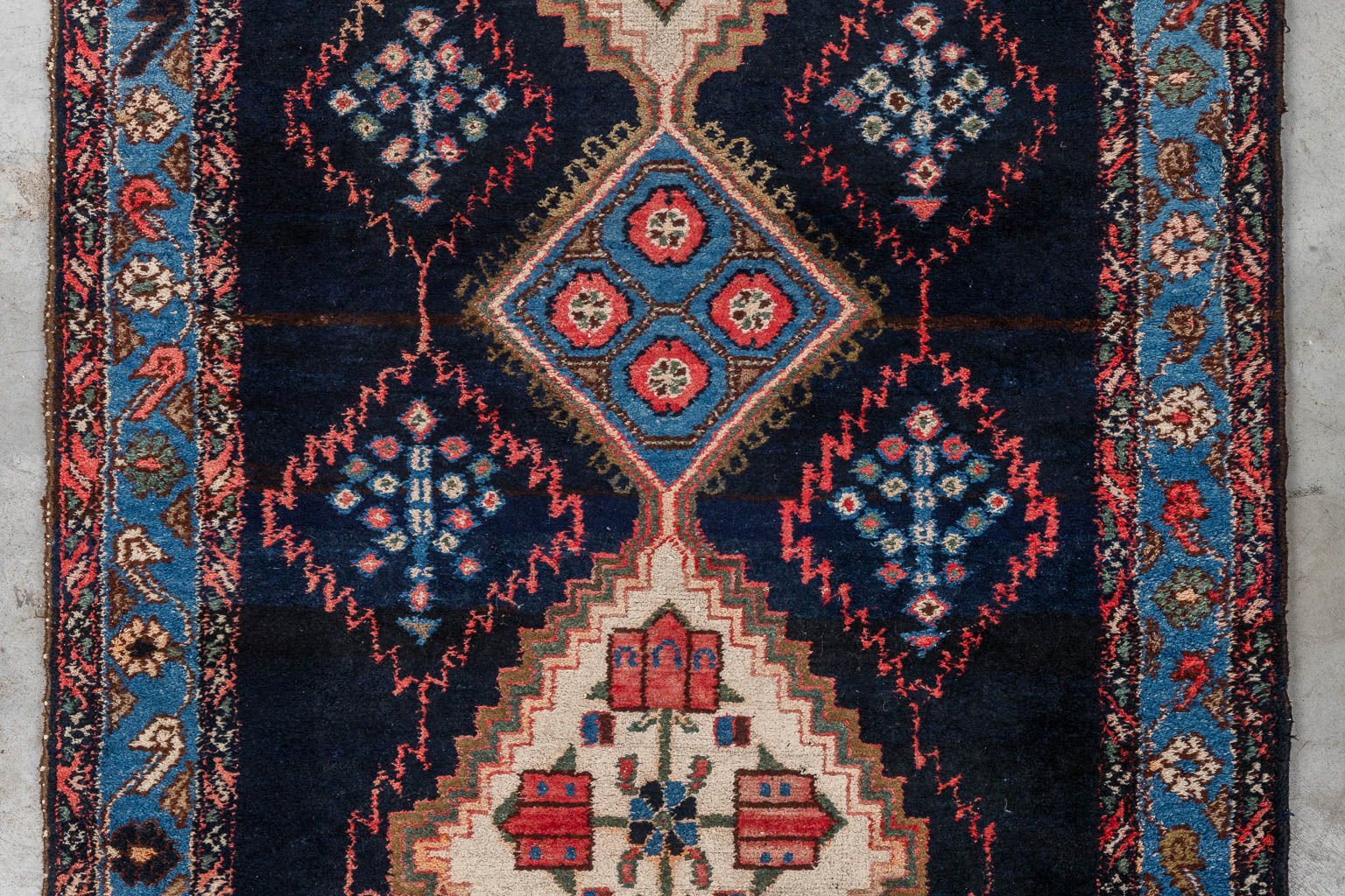 An antique Oriental carpet, runner, Hamadan, Iran. (D:500 x W:111 cm)