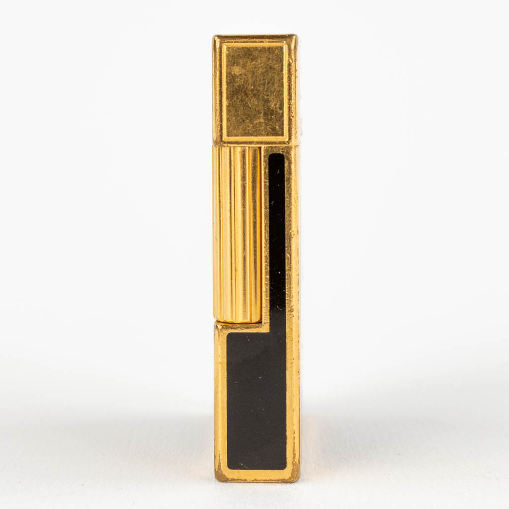 S.T Dupont, Columbus 1492, a lighter, gold-plated metal. (D:1,1 x W:3,7 x H:5,5 cm)