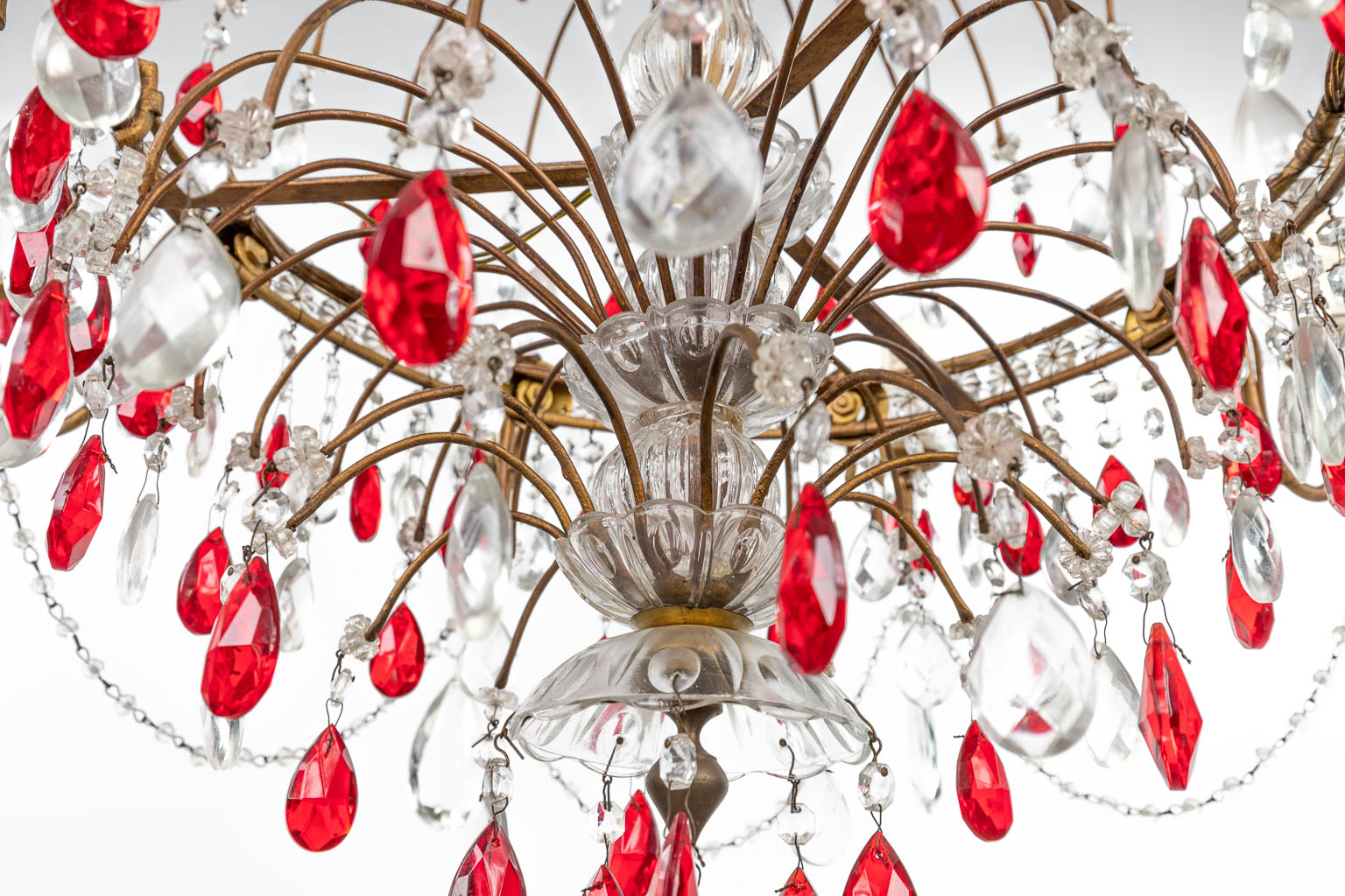 A decorative chandelier made of brass and decorated with white and red glass. (H:95cm)
